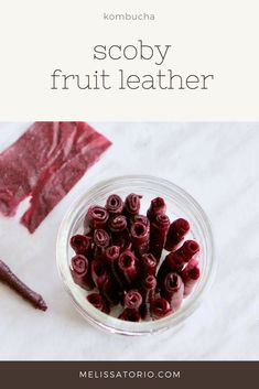 a glass bowl filled with cranberry sorby fruit leather