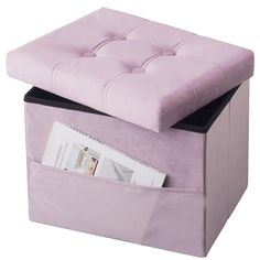 a purple ottoman with magazine holders underneath it