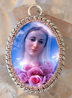 - Our Lady of Medjugorje - . I created this unique and meaningful necklace designs in honor of Our Lady of Medjugorje. Express your faith and devotion with this handmade necklace, it's a very powerful piece and a true gift for yourself or someone special. . Created With: Beautiful 40x30mm pendant with image of Our Lady of Medjugorje adorned with light pink rhinestones. This pendant comes with chain. Materials: Rhinestones & Metal - All medals come with prayer . Please note: This necklace its Spiritual Jewelry With Miraculous Medal As Gift, Oval Our Lady Of Guadalupe Necklace Gift, Oval Our Lady Of Guadalupe Necklace For Gift, Spiritual Oval Our Lady Of Guadalupe Necklace, Spiritual Oval Necklace Featuring Our Lady Of Guadalupe, Miraculous Medal Pendant Necklace For Memorial, Miraculous Medal Pendant Necklace For Memorials, Our Lady Of Guadalupe Round Pendant As Gift, Spiritual Our Lady Of Guadalupe Pendant Necklace