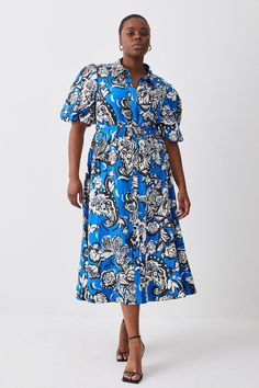 Plus Size Batik Viscose Linen Belted Midi Shirt Dress Summer Midi Dress With Batik Print, Blue Abstract Print Short Sleeve Dress, Blue Short Sleeve Dresses With Abstract Print, Blue Short Sleeve Dress With Abstract Print, Blue Batik Print Dress For Spring, Fitted Batik Print Dress For Spring, Blue Floral Print Short Sleeve Shirt Dress, Blue Collared Printed Dress, Blue Printed Collared Dress