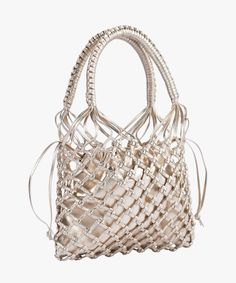 a white handbag is shown against a white background and it's handles are made out of woven material