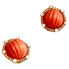 Simple but extremely elegant earrings. Main stone is carved fluted Sciacca Mediterranean coral of a warm lush orange tonality. Very well carved, of even color throughout and well matched. The gems are set within a rope twisted 18kt gold halo. This border with six nicely sized brilliant fiery white diamonds. This is some of the prettiest coral I’ve had in a while. The earrings are secured with a clip back. Judging from the style and quality of the material I think these beautiful pair date from s Elegant Orange Clip-on Earrings, Elegant Carved Orange Jewelry, Elegant Orange Carved Jewelry, David Webb, Mabe Pearl, Rope Twist, Gold Clips, Coral And Gold, Gold Halo