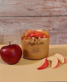 an apple crisp in a glass next to sliced apples