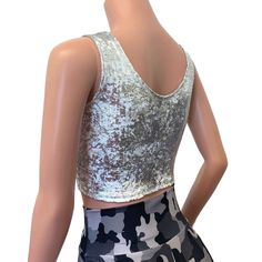 The perfect crop tank top for your rave or festival outfit. This top is made of 4-way stretch white with silver gilded metallic velvet. Top fit snug to the body and sits above the belly button. Shiny Fitted Tank Top For Night Out, Fitted Shiny Tank Top For Night Out, Metallic Fitted Tank Top For Night Out, Fitted Metallic Tank Top For Night Out, Glamorous Fitted Metallic Tank Top, Fitted Metallic Tank Top For Party Season, Stretch Tank Crop Top For Party, Metallic Fitted Tank Top, Fitted Metallic Shiny Crop Top