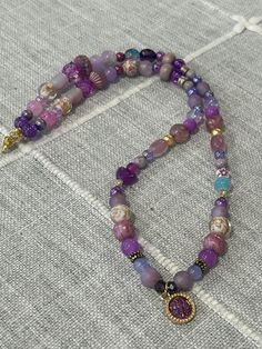 23 inches end to end, pendant .5 inch Long Single Strand Crystal Necklace For Jewelry Making, Beaded Round Pendant Necklaces For Healing, Bohemian Single Strand Pendant Beaded Necklace, Purple Necklaces With Colorful Round Beads, Colorful Beaded Amulet Pendant Necklace, Colorful Beads Amulet Pendant Necklace, Purple Beaded Chain Necklace With Round Beads, Beaded Pendant Long Necklace As A Gift, Purple Single Strand Bohemian Beaded Necklace