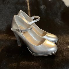 Ynot? Size 7,Sliver Mary Jane Block Heels, Never Worn, Has A Pen Size Indention On Left Shoe Shown In Picture. Silver Heels Thick Heel, Metallic Silver Heels With 4-inch Heel Round Toe, Metallic Silver Heels With 4-inch Round Toe, Silver Shiny Heels For Formal Occasions, Glamorous Metallic Silver Closed Toe Heels, Formal Silver Shiny Heels, Metallic Closed Toe Heels With 4-inch Heel, Silver Closed Toe Heels With Padded Heel, Silver Platform Heels With Pointed Toe