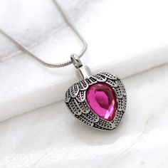 This personalized birthstone pendant urn for women is a handmade item made from 316L surgical grade stainless steel material with a crystal stone. The pendant size is 35x23mm, can be customized back of the necklace with an engraving of your choice, making it a unique. This is the perfect gift and the unique way to carry your loved ones close to your heart,Every necklace can be filled with one  funnel kits,You can access the compartment in the pendant through a small screw in the top. --HOW TO OR Ashes Necklace, Pretty Jewelry Necklaces, Angel Heart, Gift Delivery, Urn Necklace, Everyday Gifts, Urn Necklaces, Human Ashes, Memorial Necklace