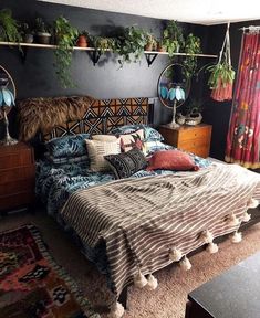 a bed room with a neatly made bed and lots of plants