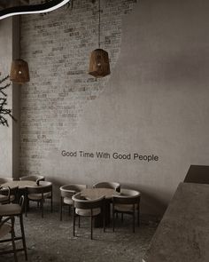 an empty restaurant with tables and chairs in front of a brick wall that says, good time with good people