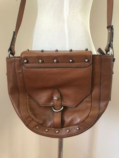 Kooba Jules Leather Crossbody Bag Handbag Purse in 230 Earth Brown Med $328 NWT. Featuring an adjustable crossbody strap with magnetic top closure and zipper. It has an exterior slip pocket perfect for your phone or sunglasses and an interior zipper pocket. SUPER SOFT LEATHER, it is lightweight and very roomy inside. Measures: Length 9"; Width 11"; Depth 3"; Strap Length 21" adjusts to 23". Retail $328.00. https://www.ebay.com/str/fabulousfindsshop Leather Shoulder Bag With Silver-tone Hardware For On-the-go, Daily Use Crossbody Shoulder Bag With Silver-tone Hardware, On-the-go Hobo Bag With Metal Hardware, Leather Saddle Shoulder Bag With Metal Hardware, Leather Satchel Shoulder Bag With Metal Hardware, Bags With Silver-tone Hardware For Daily Use, Leather Crossbody Shoulder Bag With Metal Hardware, Crossbody Bag With Detachable Strap, Luxury Crossbody Bag With Silver-tone Hardware