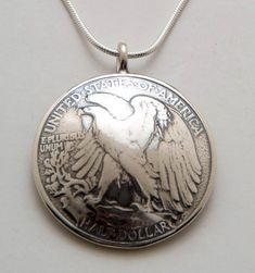 Pendant made from a vintage silver American Walking Liberty half dollar coin.  The back is domed as the front of the pendant. Yours may have a soldered ring as pictured, or it may be drilled, with a free-flowing ring, depending on what we have in stock. This pendant comes on a sterling silver bead chain.  Please select length from the drop-down menu.Thanks for looking.  Enjoy! Reversible Jewelry, Woodstock Ny, Memorial Jewelry Ashes, Eagle Pendant, Sand Dollar Pendant, Half Dollar Coin, Wearable Art Jewelry, Silver Eagle, Silver Eagles