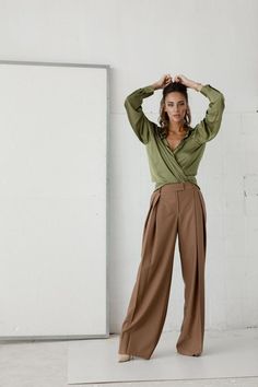 Elegance is the first thing you want to say when you see this image. The perfect combination of femininity and luxury Elegant High-waisted Culottes For Office, Elegant Brown Pants For Workwear, Elegant Brown Wide Leg Workwear Pants, Brown Wide-leg Pants For Office, Elegant Straight Culottes, Elegant Brown Pants For Fall, Chic Brown Full Length Wide Leg Pants, Chic Brown Full-length Wide Leg Pants, Elegant Brown Wide Leg Pants