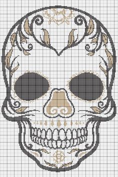 a cross stitch skull is shown in black and white