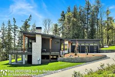 this is an image of a modern style house in the woods with lots of trees