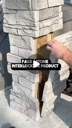 a man is working on the side of a building with an interlock product sticker