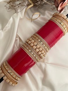 Bridal indian red wedding chooda. size 2.8 .  perfect for your wedding day.  includes - 24 red bangles (each hand)                    16 gold size bangles.( each hand) total-  48 red bangles( both hands)             32 gold bangles (both hands) Style tip- ----------- Pair it with any beautiful traditional outfits  and flaunt with Unique style of collection from us. Perfect match for Festival and Traditional wear.  Take Care Tips-  ---------------- Kee away from perfume, Hair spray and. Moisture. Red Kundan Necklace With Stone Work For Puja, Traditional Red Bangle With Gota Work, Red Stone Work Bangle For Diwali, Diwali Red Stone Work Bangle, Red Bracelets With Zari Work For Festive Season, Festive Red Bracelets With Zari Work, Festive Red Kundan Bridal Set, Heavy Red Bangle For Wedding, Red Bollywood Bangle With Stone Work