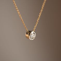 A 0.85 carat diamond in a classy bezel setting = Your minimalist dreams come true Materials: 14k Yellow Gold & Diamond Weight: 0.85ct VS1 G Diamond *Chain not included Luxury Smooth Bezel Necklace For Formal Occasions, Luxury Drop Jewelry With Bezel Setting, Luxury Diamond White Jewelry With Bezel Setting, Bezel Pendant Ideas, Diamond Pendant Necklace Simple, India Trip, Solitaire Diamond Pendant, Bezel Necklace, Repurposed Jewelry