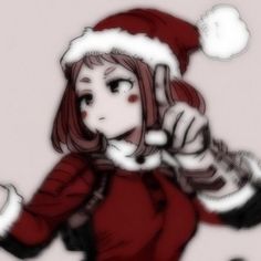 a girl in a santa hat pointing at something