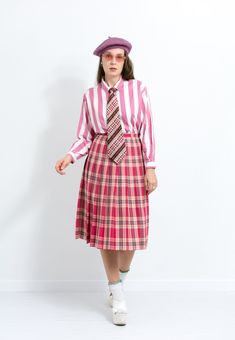 Vintage preppy style pleated skirt in plaid red-pink pattern - midi length - lined - materials: 65% polyester, 35% viscose; lining - 100% polyester CONDITION (1-10) - 8 - Good vintage condition. SIZE size from label: EUR 38, UK 10 best fits women: M MEASUREMENTS waist: 27,5 inches (70 cm) hips: free length: 29 inches (74 cm) The model is 5'9" (174 cm), measures 35-27-38 (90-69-96 cm) In the photo: Trench: https://www.etsy.com/listing/1307188839 Pink Midi Pleated Skirt For Work, Preppy Plaid Pleated Lined Skirt, Preppy Pleated Skirt, Preppy Pink Pleated Skirt, Red Preppy Skirt, Fall Pleated Pink Skirt, Pink Pleated Skirt For Fall, Preppy Pleated Plaid Skirt, Preppy Pink Pleated Lined Skirt