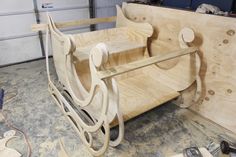 a wooden bench being constructed in a shop