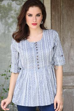 Ritu Agnihotri of India presents this casual grey cotton blouse, featuring a stunning motif in white. Artisans use a traditional block printing technique to create a rippled line and bubble motif. This blouse features three-fourth sleeves and coconut shell button accents. Floral Embroidered Top, Shirts Design, Cotton Blouse, Off Shoulder Tops, Cotton Top, Cotton Blouses, Trendy Tops, Cotton Tops, Stylish Dresses