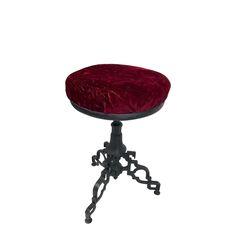 a small stool with a red cushion on it's top and black metal legs