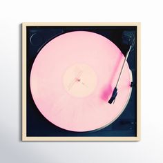 an old record player with pink vinyl on it