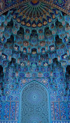 an intricately decorated building with blue tiles