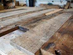 a close up of some wood planks on a table in a shop or workshop