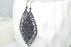 Black Leaf pendants are combined with black ear wires. Earrings measure at 3 inches long. Ready to ship! Black Pierced Chandelier Earrings As Gift, Black Pierced Chandelier Earrings For Gift, Black Chandelier Drop Earrings With Ear Wire, Black Chandelier Earrings As Gift, Elegant Black Chandelier Earrings With Ear Wire, Black Hypoallergenic Earrings For Party, Black Teardrop Earrings As Gift, Black Teardrop Earrings With Ear Wire For Gift, Handmade Black Teardrop Earrings For Party