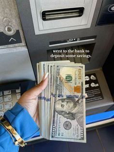 someone is holding money in front of an atm machine that says, want to the bank to deposit some savings