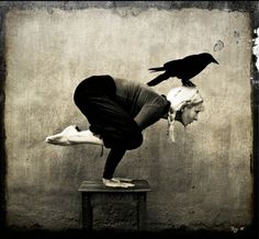 a woman doing a handstand with a crow on her head and the caption reads, if it doesn't challenge you, it doesn't change you