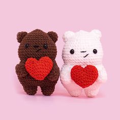 two crocheted teddy bears with hearts on their chests, one is brown and the other is white