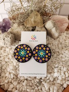 These unique wooden mandala stud earrings are a stunning piece of wearable art that will make a great addition to your accessory collection! Dress them up or wear them casually either way they are sure to suit every occasion. The wooden discs are hand painted dot by dot and sealed for shine and protection and they are light weight which makes them very comfortable to wear! The hand painted discs come on a surgical steel post with butterfly clasp The total size of earring is approx 3.5cm in diameter. If you love this design but would like it in a different colour please feel free to message me and I will be more than happy to chat with you about creating something for you. Note: *This is a loving handmade piece and is classed as costume jewellery, It should be handled with care and never su Painted Discs, Dot By Dot, Mandala Jewelry, Main Point, Hand Painted Earrings, Painted Earrings, Mandala Stones, Steel Post, Make Color