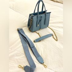 Perfect Condition Blue Square Satchel For Shopping, Trendy Light Blue Bag With Detachable Handle, On-the-go Blue Rectangular Satchel, Blue Square Satchel With Removable Pouch, Blue Square Shoulder Bag With Removable Pouch, Light Blue Top Handle Shoulder Bag With Gold-tone Hardware, Zara Bag With Adjustable Strap For On-the-go, Blue Square Bag With Removable Pouch, Blue Rectangular Box Bag Casual