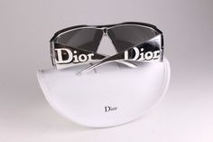 Vintage 2000's sunglasses CHRISTIAN DIOR, made in Italy, model Overshine 2, silver color. Frame with personality with high quality materials.  Excellent condition with wear on the frame, and some scratches on the lenses, see pictures. Delivered with original Dior case. Ref: OB1137 CONDITION: Excellent  DIMENSIONS: Lens width: 70 mm Lens height: 52 mm  Frame width: 140 mm  Temple length: 110 mm Engraved on the temple:  OVERSHINE 2 N6JSF 110 More vintage items in my online shop: http://www.vintage Futuristic Silver Sunglasses With Mirrored Lenses, Trendy Silver Shield Sunglasses With Polarized Lenses, Modern Silver Sunglasses With Uva Protection, Silver Sunglasses With Uv Protection For Streetwear, Silver Shield Sunglasses With Uva Protection For Summer, Summer Silver Shield Sunglasses With Uva Protection, Trendy Silver Anti-reflective Shield Sunglasses, Summer Silver Shield Sunglasses With Anti-reflective Coating, Silver Sunglasses For Summer Streetwear