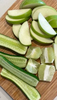 sliced up cucumbers on a wooden cutting board