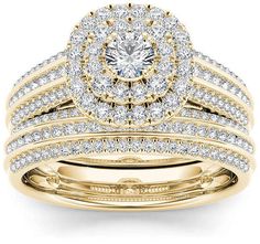 a yellow gold wedding ring set with two rows of diamonds