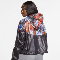 Floral Print Adds Tropical Flavor. Cropped Design Hits Above The Hips. Iconic Chevron Design Lines Throw Back To The Original Windrunner Jacket. Drawcords Let You Adjust How The Hood And Waistband Fit. Lower Panels Are Color Blocked For Playful Contrast. Brand New With Tags. Nike Athleisure Outerwear, Casual Nike Outerwear For Workout, Nike Athleisure Track Jacket For Fall, Nike Sporty Outerwear For Workout, Nike Sportswear For Workout, Nike Sportswear Outerwear For Workout, Nike Sportswear Windbreaker For Fall, Nike Fall Workout Track Jacket, Nike Fall Track Jacket For Workout