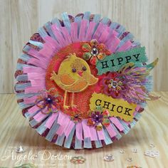 a close up of a paper plate with a bird on it's face and the words happy chick