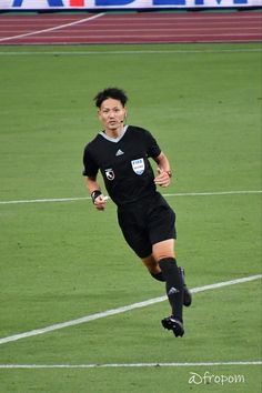 a soccer player is running on the field