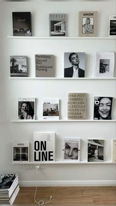 there are many books and magazines on the wall