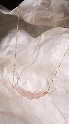 This beautiful and elegant Rose Quartz necklace - features the gentle and soothing gemstone that symbolizes the essences of unconditional love and a warm embrace. This bracelet is handcrafted with premium gold plated anti-tarnish brass wire. Designer grade A faceted rose quartz imported from Japan will dress up any outfit and its simple design allows it to be stackable with any other pairings! All pieces are made with lots of love! I hope that my creations can spark some joy into your hearts &lt Elegant Healing Jewelry For Mother's Day, Minimalist Rose Gold Crystal Pendant Necklace, Minimalist Necklaces For Healing, Pink Minimalist Birthstone Necklace, Delicate Crystal Necklace As Gift, Minimalist Rose Quartz Crystal Necklace For Gift, Minimalist Rose Quartz Crystal Necklace Gift, Minimalist Rose Quartz Pendant Necklace, Elegant Rose Gold Crystal Necklace For Healing