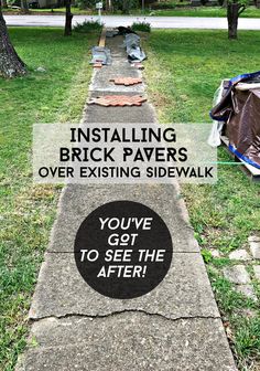 a sidewalk that has some writing on it and there is a sign in the grass reading installing brick paverss over existing sidewalk