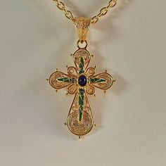 Handmade filigree Greek Orthodox Cross with enamel made of 18 carat yellow gold The Cross consists of two different pieces . The basic Cross witch is adorned with different filigree work spirals, and the upper part The second Cross is adorned with green and blue enamel The Cross is made in Greece in one of the oldest jewelry workshop that specializes in making filigree work jewelry specifically Greek style Crosses Ideal for baptism or any other special occasion ( The price does not include the c Greek Orthodox Cross, Ancient Greek Coin, Orthodox Cross, Clip On Charms, Greek Coins, Jewelry Workshop, Solid Gold Chains, Greek Style, Greek Orthodox