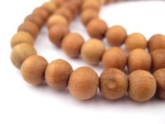 PRICES MAY VARY. Each delightful mala exudes the fragrant aroma of sandalwood Great for meditation, yoga, chanting, or worn as a necklace. Please note, for necklace use please purchase 8mm or 10mm size. 6mm size will not fit as necklace for most people Has 108 beads per strand, plus guru bead and tassel Each bead measures 7 x 8mm, with hole size of 1mm Official product of The Bead Chest These beautiful mala beads are hand-carved from natural wood in the mountainous region of Nepal. Fragrant and Beads Meaning, Mala Beads Diy, Meditation Beads Mala, Rose Quartz Mala, Sandalwood Mala, Rudraksha Mala, Sandalwood Scent, Beads Mala, Meditation Beads