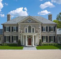 a large stone house with lots of windows