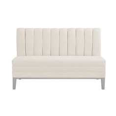 a white couch sitting on top of a wooden floor