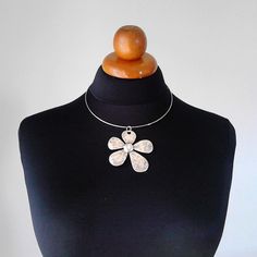 Beautiful minimalist necklace made with a gorgeous flower brass pendant, nickel free. It is a stunning piece, perfect to make everyone's attention turned on you. Choker included ! Contains no lead or nickel. Do not perfume over it or subject it to any liquid substances. I love the pure metal. But over time, metal will darken slightly, but when you rub stationery eraser, brilliance will return. Composition: I always use natural materials, in this case real brass. The materials I use, are made from a small local traditional company. They use natural products such as cotton, silk and viscose and they love colors. The materials are really expensive here compared with them are made in others country but they are ecological, skin friendly, they don't fade and they have very good resistance. Τhei Adjustable Metal Necklace With Flower Charm, Adjustable Metal Necklace With Flower Pendant, Adjustable Metal Flower Pendant Necklace, Spring Choker Jewelry Gift, Spring Flower Choker Necklace As Gift, Spring Flower Choker Necklace For Gift, Spring Gift Choker Jewelry, Metal Flower Charm Necklaces, Flower Charm Choker As A Gift