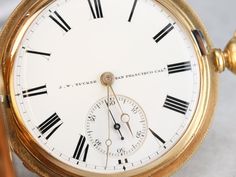 "This is the most exquisite pocket watch we've had the opportunity to offer, in perfect condition, this is quite the collector's piece! This antique pocket watch dates to the 1860s, by the J.W. Tucker San Francisco watch company. The face bears two dials, one for seconds and the other for minutes and hours; black, simple hands and stark Roman Numerals. This is a hunter's case, beautifully ornate, one side has blooming flowers in its center while the other has a shield design with a scrolling \"L Antique Pocket Watch, Clock Repair, Time Keeper, Shield Design, Metal Pendant